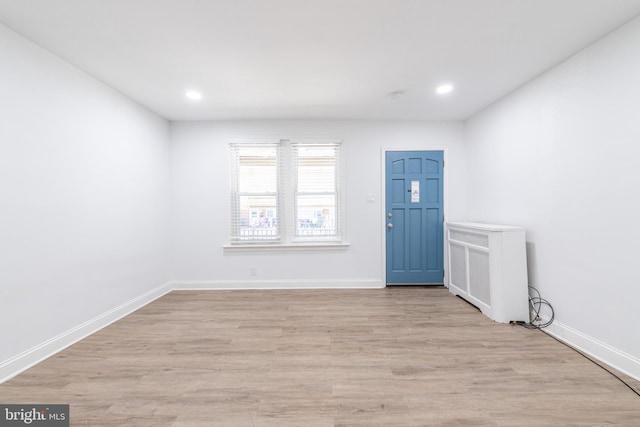 unfurnished room with light hardwood / wood-style floors