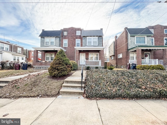 multi unit property featuring a porch