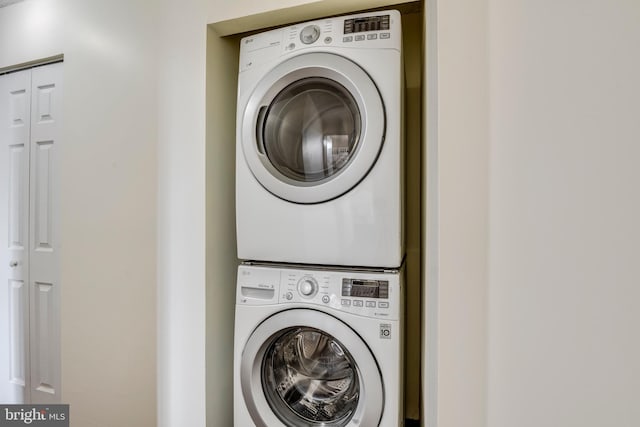 laundry area featuring laundry area and stacked washing maching and dryer