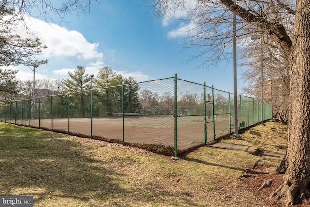 view of sport court with fence