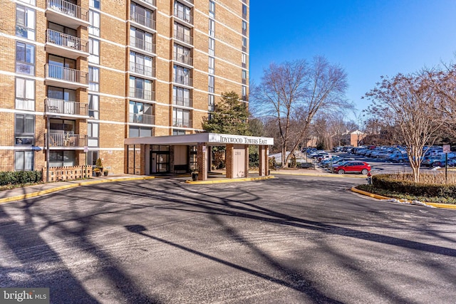 view of property featuring uncovered parking