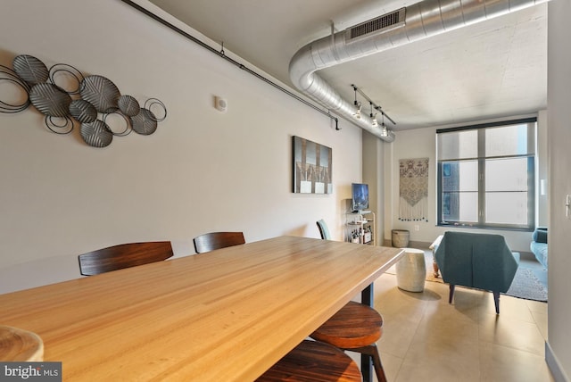 dining room featuring tile patterned flooring