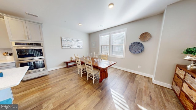 dining room featuring light hardwood / wood-style floors