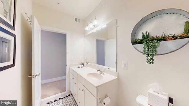 bathroom with vanity and toilet