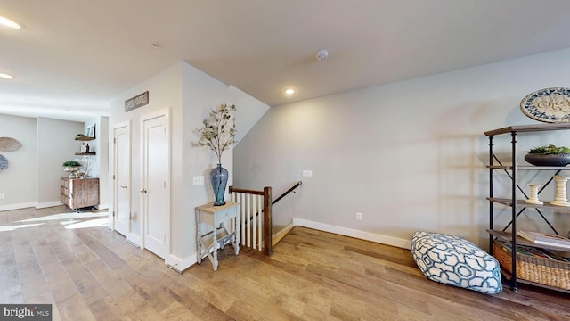 hall with light hardwood / wood-style floors