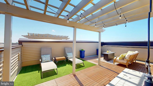 deck featuring a pergola and an outdoor living space with a fire pit