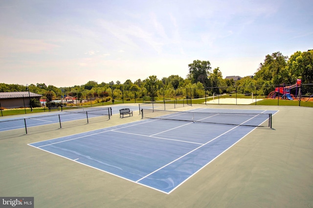 view of sport court featuring a playground