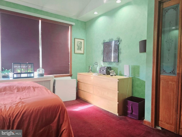 carpeted bedroom featuring lofted ceiling