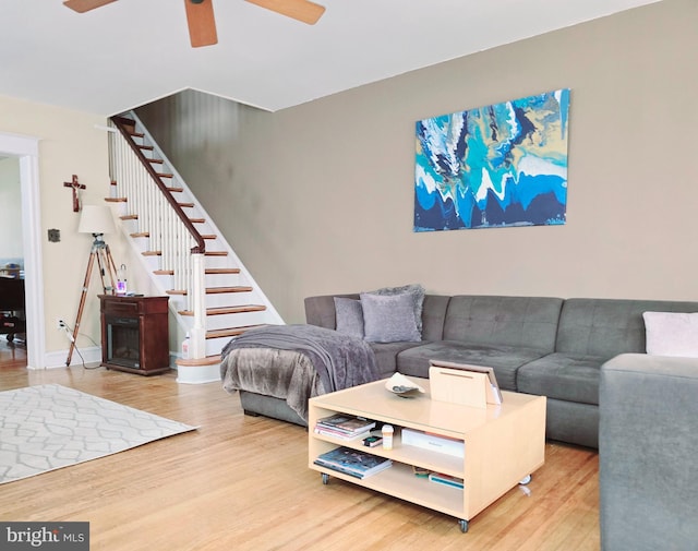 living room with ceiling fan and hardwood / wood-style floors