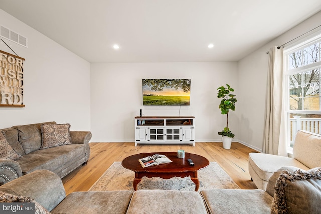 living room with light hardwood / wood-style flooring