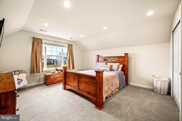 bedroom with vaulted ceiling and light colored carpet