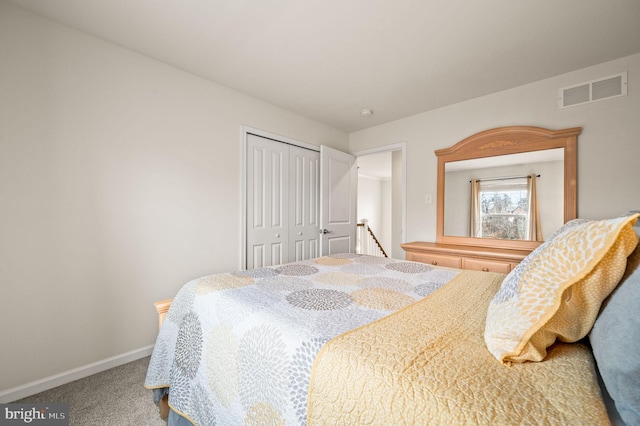 bedroom with carpet flooring and a closet