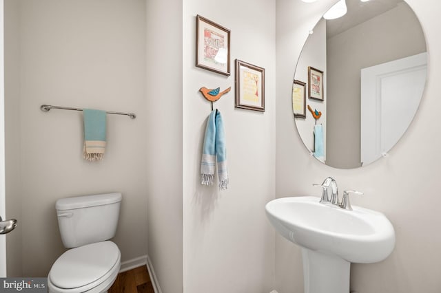 bathroom featuring toilet and sink