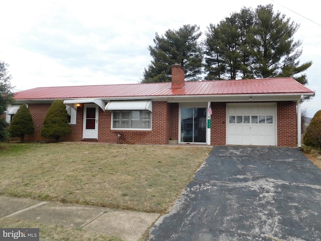 single story home featuring a garage and a front yard