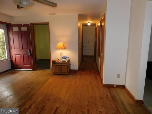 hallway featuring hardwood / wood-style floors