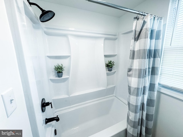 bathroom featuring shower / bath combination with curtain