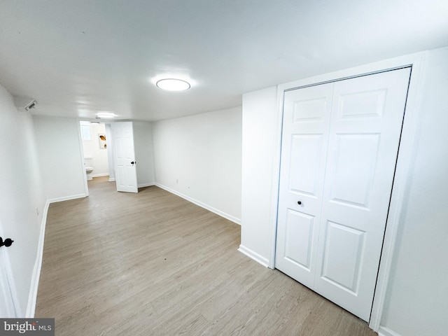 basement featuring light hardwood / wood-style flooring