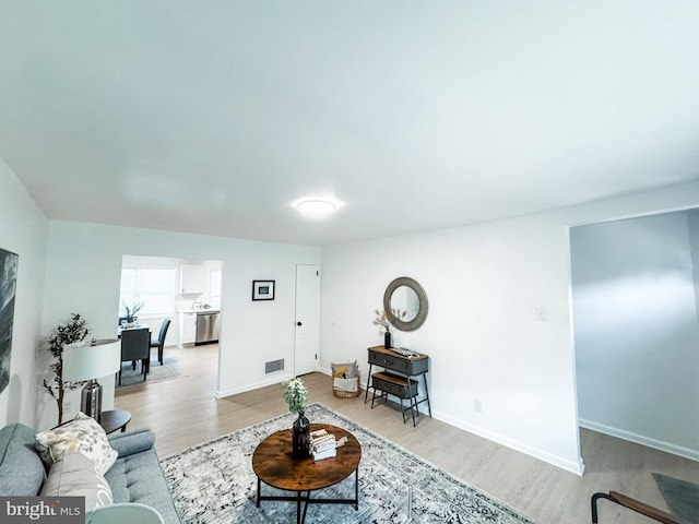 living room with light hardwood / wood-style flooring