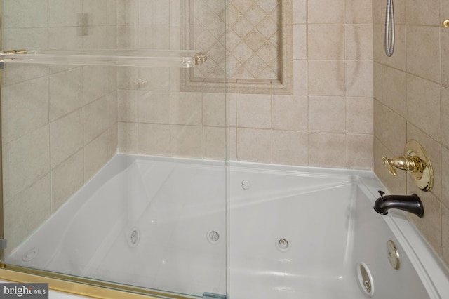 bathroom with a tub to relax in