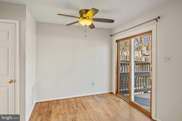 unfurnished room featuring ceiling fan and light wood-type flooring