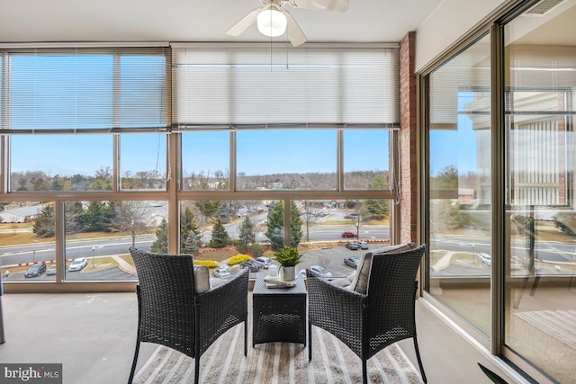 sunroom / solarium with a ceiling fan