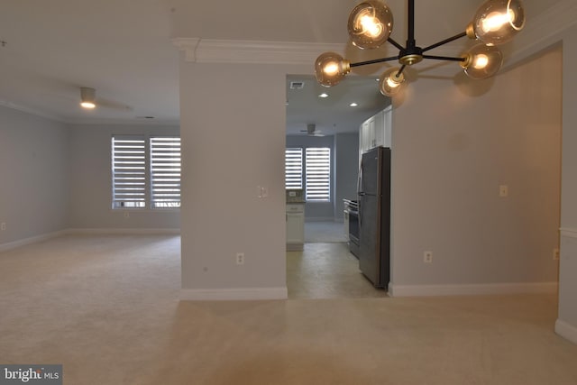 unfurnished room featuring crown molding, visible vents, baseboards, and light carpet