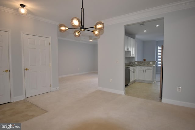 unfurnished dining area with a chandelier, light carpet, baseboards, and ornamental molding