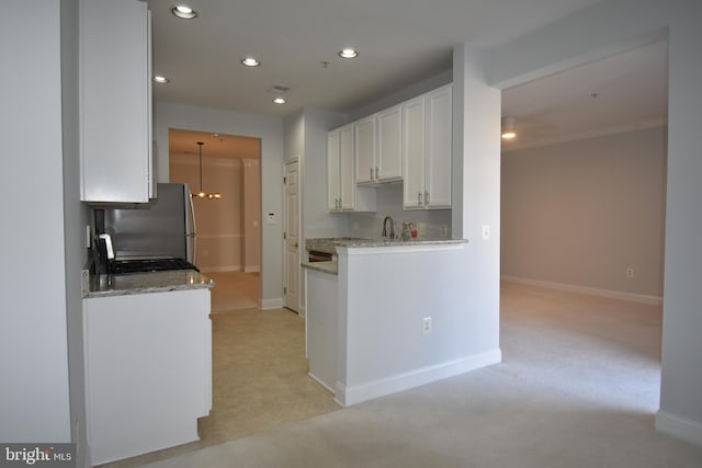 kitchen featuring recessed lighting, baseboards, and white cabinetry