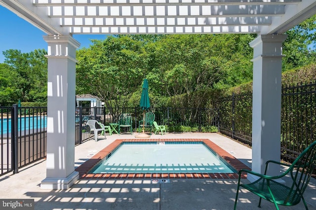 view of swimming pool featuring a fenced in pool, a patio, fence, and a pergola