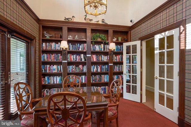 dining space with a chandelier, french doors, and carpet floors