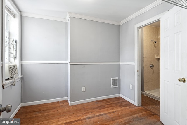 spare room featuring ornamental molding, dark wood-type flooring, and cooling unit