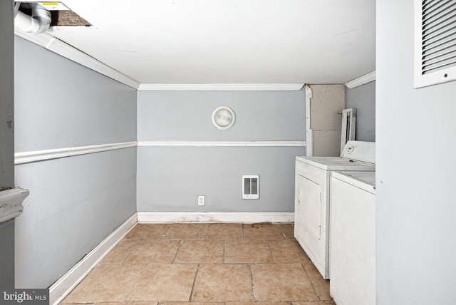 clothes washing area with crown molding and independent washer and dryer