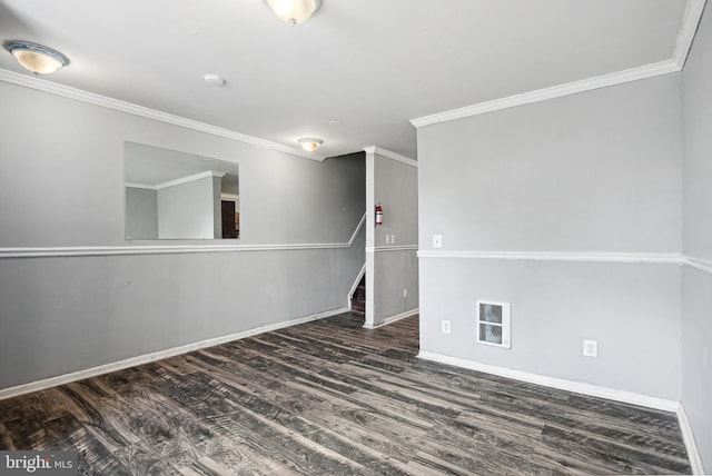 unfurnished room featuring dark wood-type flooring and ornamental molding