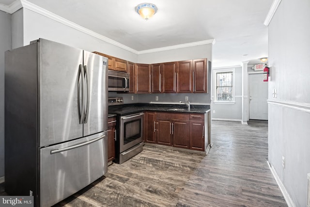 kitchen with stainless steel appliances, ornamental molding, dark wood-type flooring, and sink