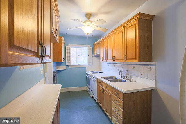 kitchen featuring tasteful backsplash, sink, ceiling fan, and range