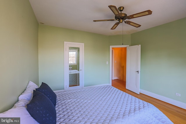 bedroom featuring ceiling fan and light hardwood / wood-style flooring