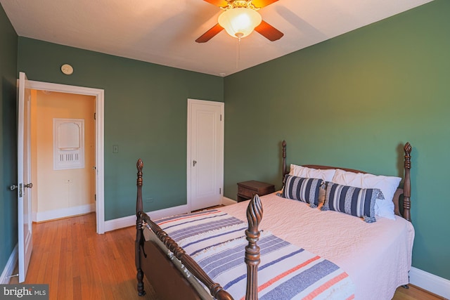 bedroom featuring light hardwood / wood-style floors and ceiling fan