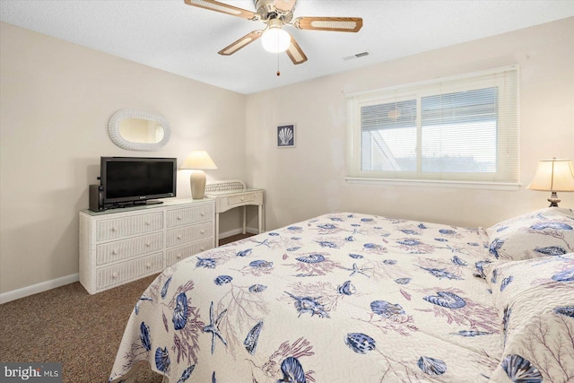 bedroom featuring carpet flooring, a textured ceiling, and ceiling fan