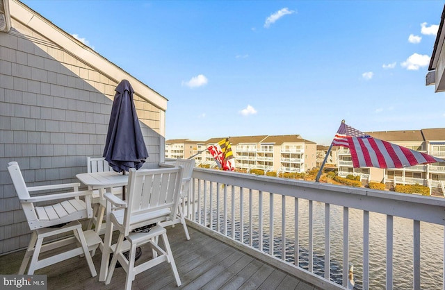 wooden terrace with a water view