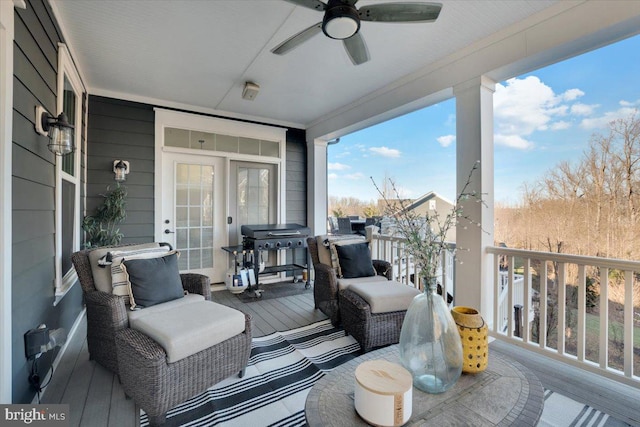 deck with ceiling fan and a grill