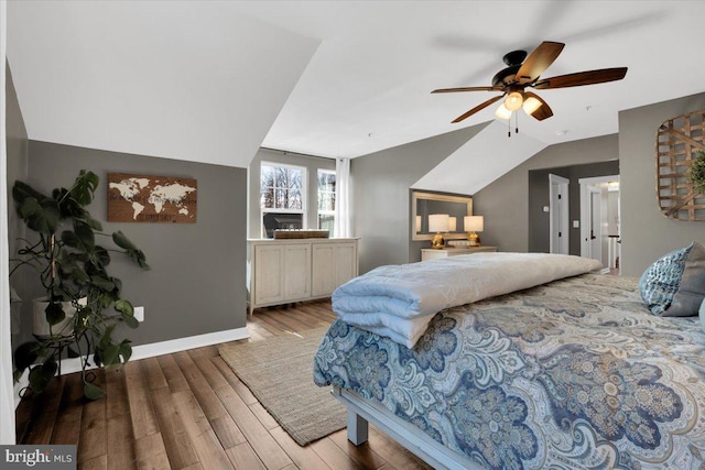 bedroom featuring vaulted ceiling, ceiling fan, and light hardwood / wood-style flooring