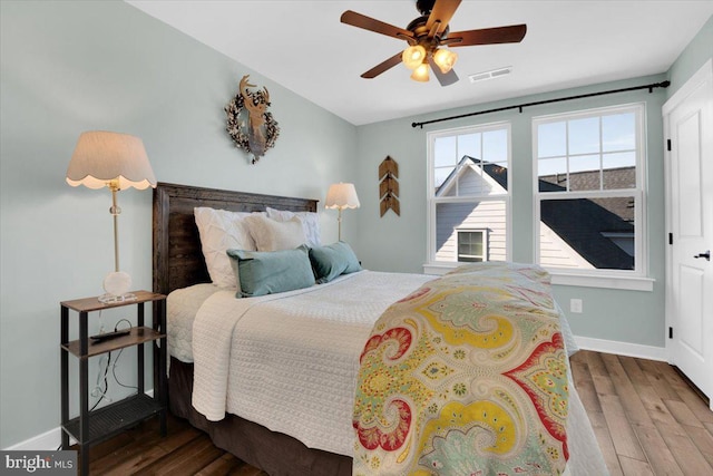 bedroom featuring hardwood / wood-style flooring and ceiling fan