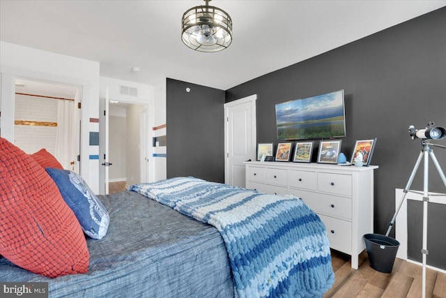 bedroom featuring wood-type flooring