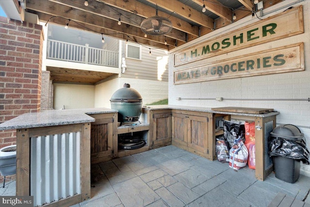 view of patio / terrace featuring area for grilling and ceiling fan