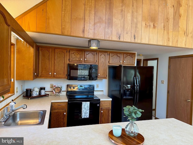 kitchen featuring sink and black appliances