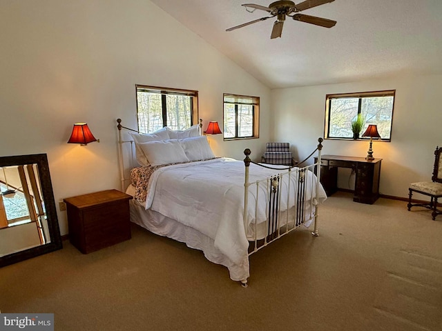 bedroom with ceiling fan, carpet flooring, and high vaulted ceiling