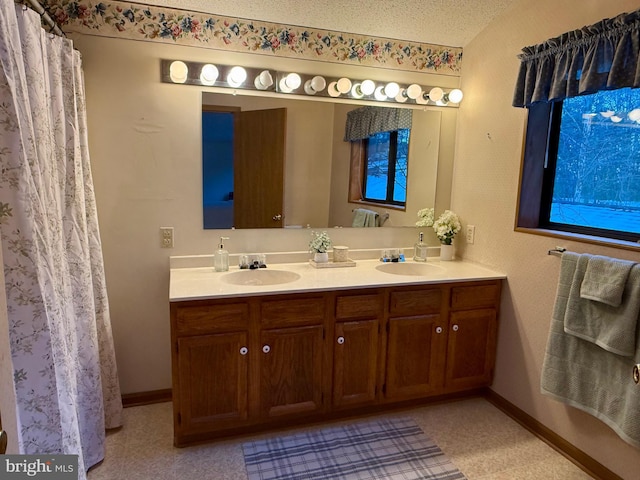 bathroom featuring vanity and a textured ceiling