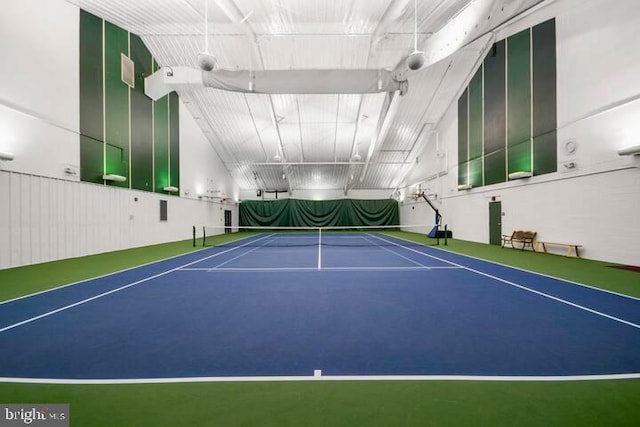 view of tennis court featuring basketball hoop