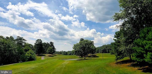 view of property's community with a lawn