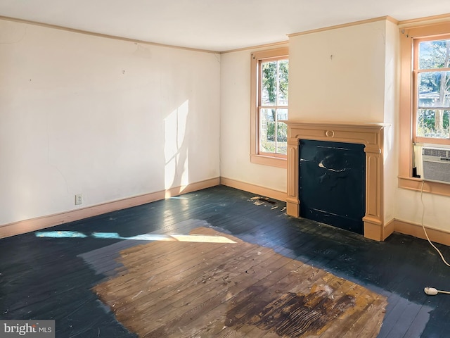 unfurnished living room with a fireplace with flush hearth, dark wood-style flooring, and plenty of natural light